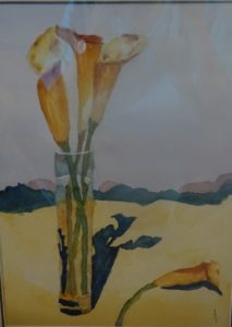 A painting of flowers in a vase on the ground