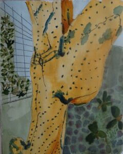 A painting of a yellow dress with green spots