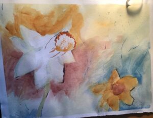 A painting of flowers in the process of being painted.