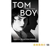 A book cover with a picture of a boy and the words " tom boy ".